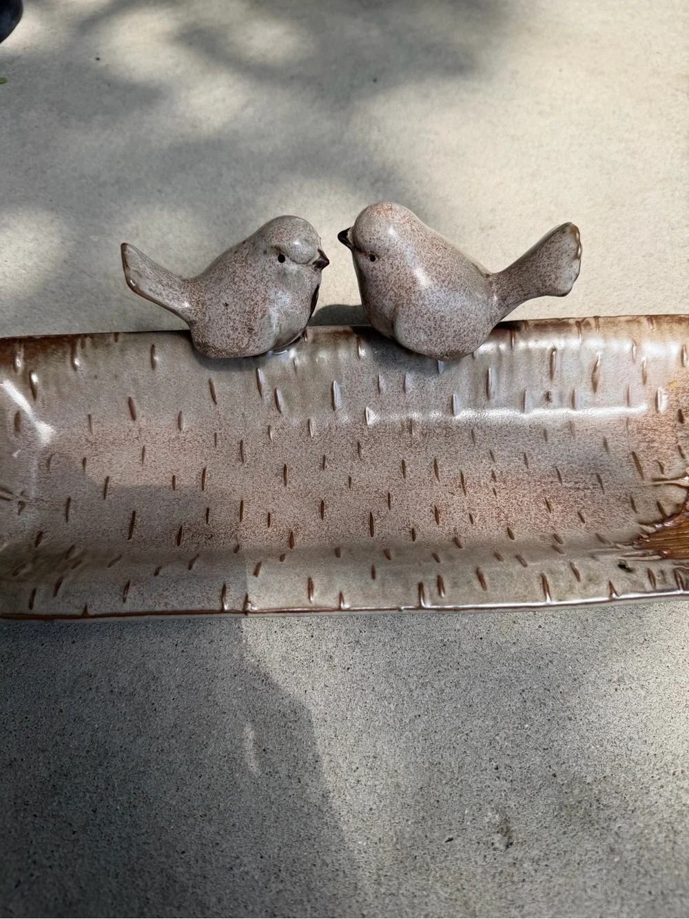 Ceramic bird feeder/tray.